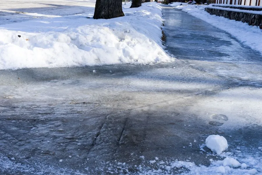 Icy Sidewalk After Snow Plowing London Ontario